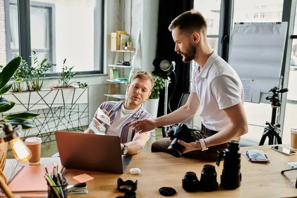 Two loving men in front of laptop, focused on work. — Stock Photo