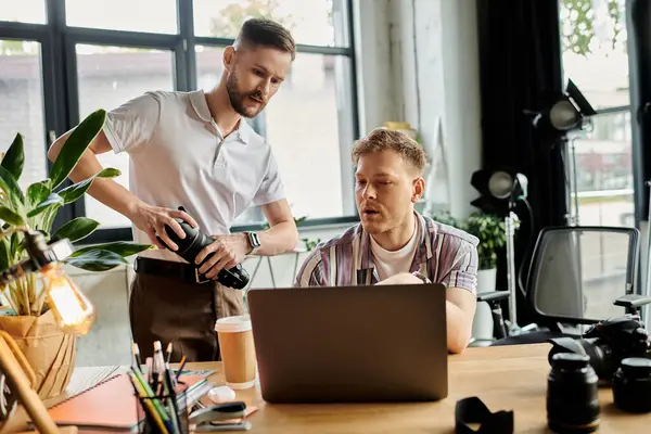 Two stylish men engaged in laptop work. — Stock Photo