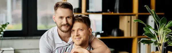 Two men lovingly hugging and looking at camera. — Stock Photo