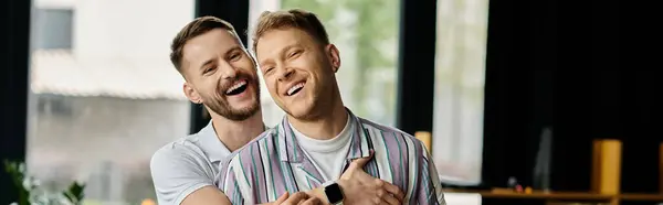 Two men in stylish outfits standing together in an office setting. — Stock Photo