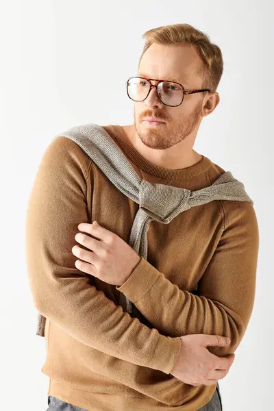 A handsome man in stylish glasses poses confidently for a portrait. — Stock Photo
