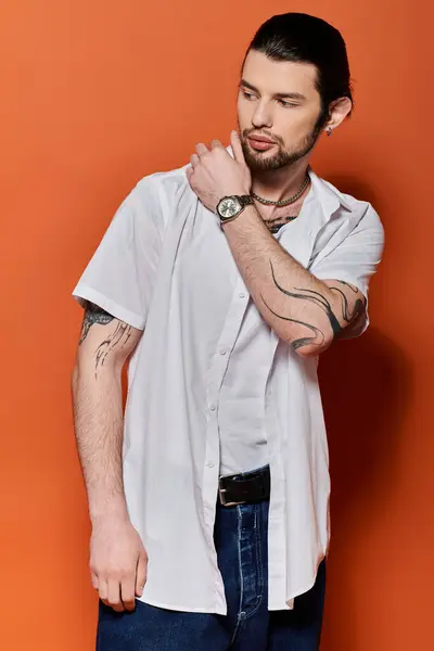 A handsome Caucasian man in trendy attire checking the time on his wristwatch. — Stock Photo