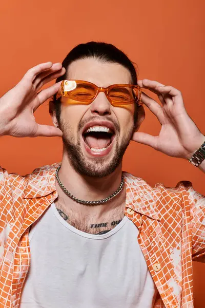 Caucasian man with glasses and a beard making a comical face. — Stock Photo