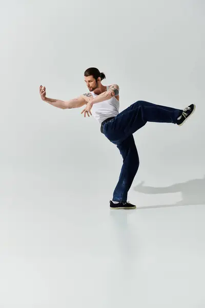 A stylish Caucasian man performs a captivating trick in his white shirt. — Stock Photo