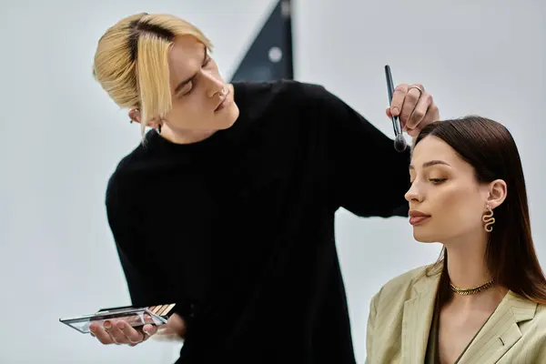 Good looking woman receives a stylish makeover from a talented male stylist. — Stock Photo