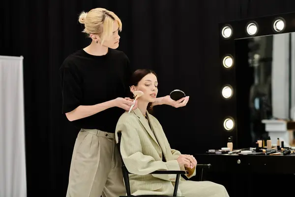 Woman getting styled by man in a chair. — Stock Photo