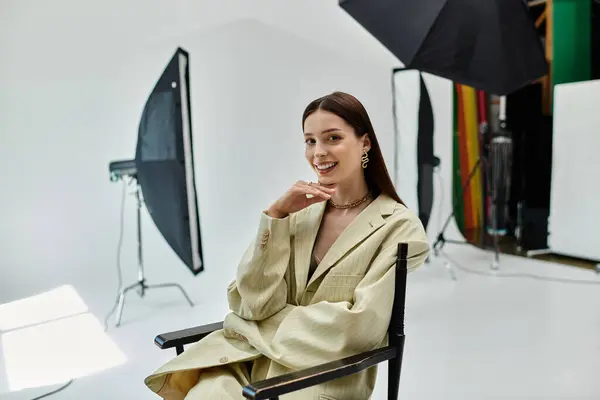 Woman sits for camera, poised and expressive. — Stock Photo