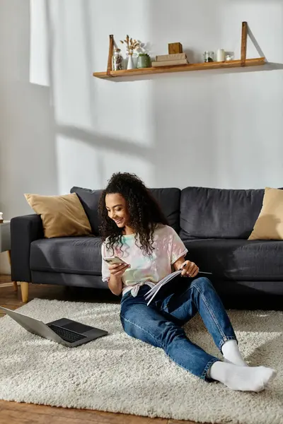 Young woman mesmerized by a laptop at home. — Stock Photo