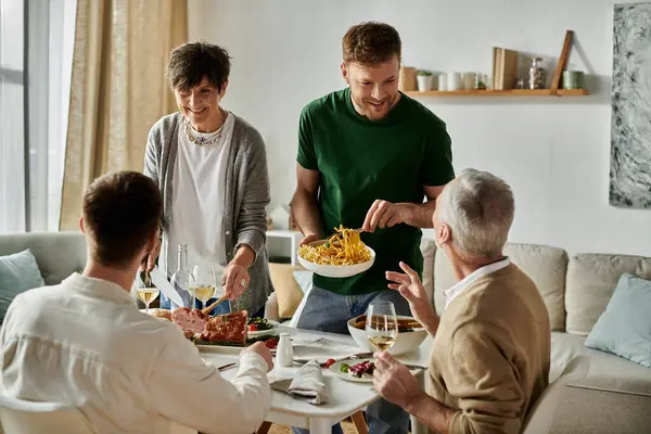 A gay couple shares a meal with parents at home. — Stock Photo