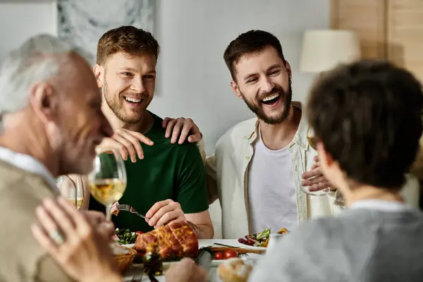 A gay couple enjoys a meal with their family, sharing laughs and conversation. — Stock Photo