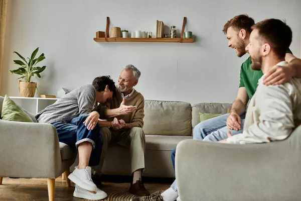 A gay couple enjoys a lighthearted moment with parents in their home. — Stock Photo