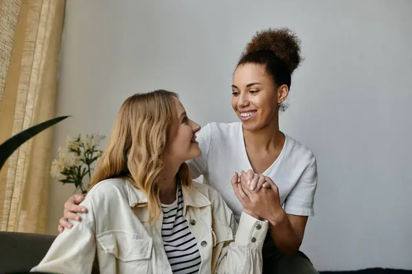 A lesbian couple shares a tender moment together at home. — Stock Photo