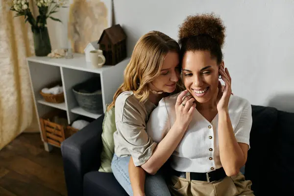 Two women share a tender moment of intimacy while relaxing at home. — Stock Photo