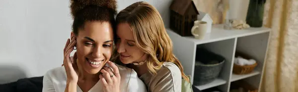 A lesbian couple shares a tender moment at home, their love and affection palpable. — Stock Photo