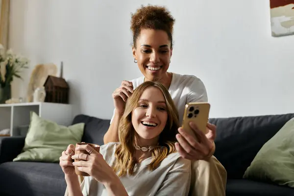 A happy lesbian couple enjoys a moment together at home. — Stock Photo
