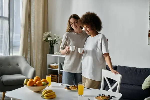 A lesbian couple enjoys a relaxing morning together at home. — Stock Photo