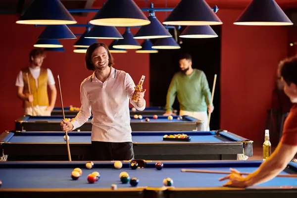 A group of friends enjoying a casual night of billiards, laughing and having fun. — Stock Photo