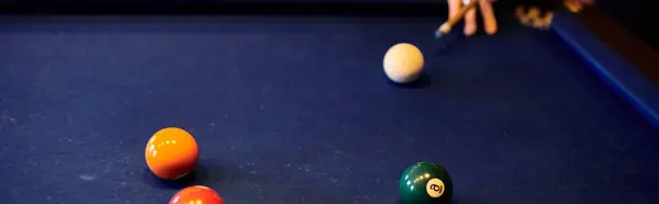 Friends playing billiards on a blue table. — Stock Photo