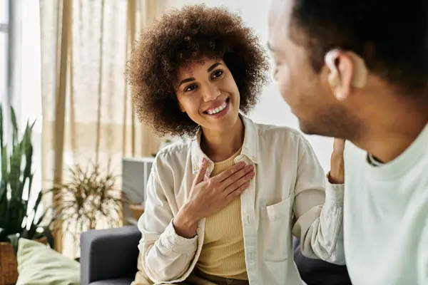 An African American couple communicates with sign language in their home. — Stock Photo