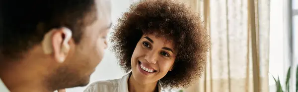 An African American woman looking at her husband. — Stock Photo
