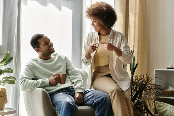 An African American couple communicates through sign language while enjoying a relaxing moment at home. — Stock Photo