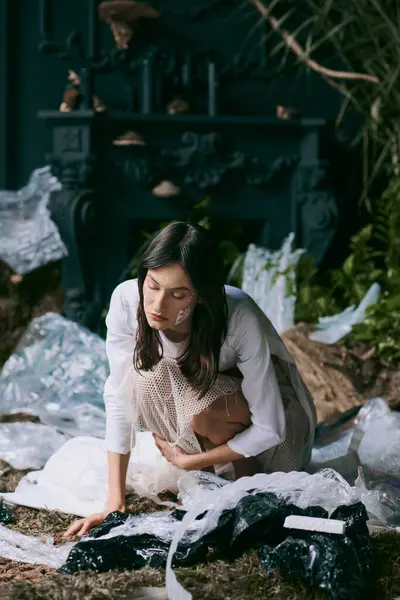 A woman in white clothing poses amidst a swamp of plastic garbage. — Stock Photo