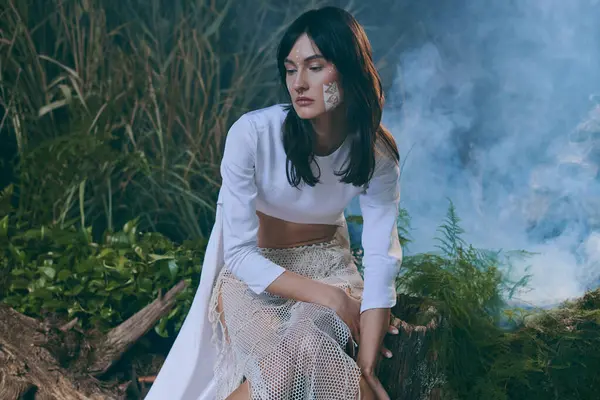 Woman in white attire poses near swamp amid lush foliage. — Stock Photo