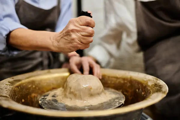 A lesbian couple enjoys a cozy pottery workshop, shaping clay into beautiful creations. — Stock Photo