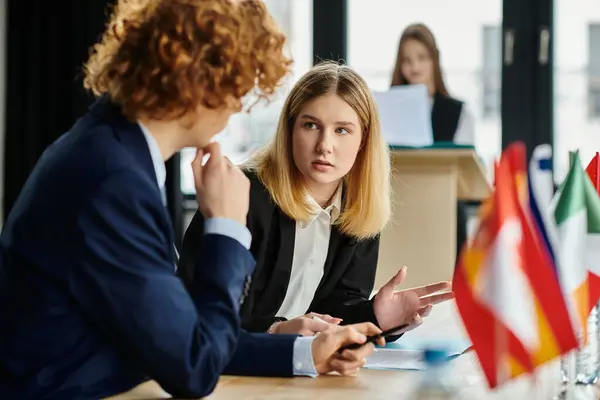 Two teenagers in suits participate in a Model UN conference. — Stock Photo