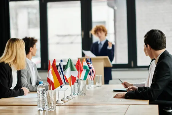 Teenagers participate in a Model UN conference, taking on roles of diplomats from around the world. — Stock Photo
