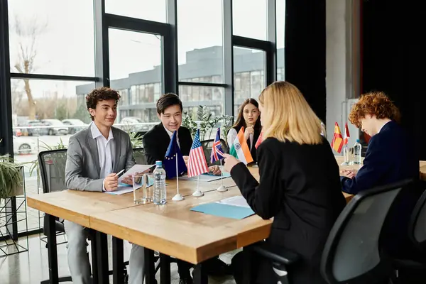 Teens in Model UN engage in diplomatic discussions and debate. — Stock Photo