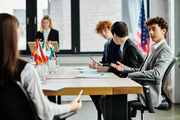 Teenagers participate in a Model UN conference, discussing global issues. — Stock Photo