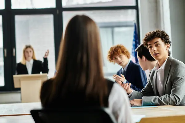 Teenagers participate in a Model UN conference, engaging in lively debate and diplomacy. — Stock Photo