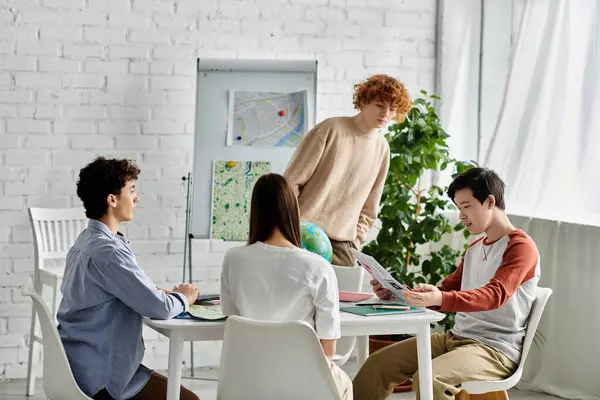 Four teenagers participate in a UN Model simulation, engaging in discussion and debate. — Stock Photo