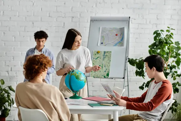 Teenagers participate in a UN Model simulation, using a globe and maps to discuss global issues. — Stock Photo