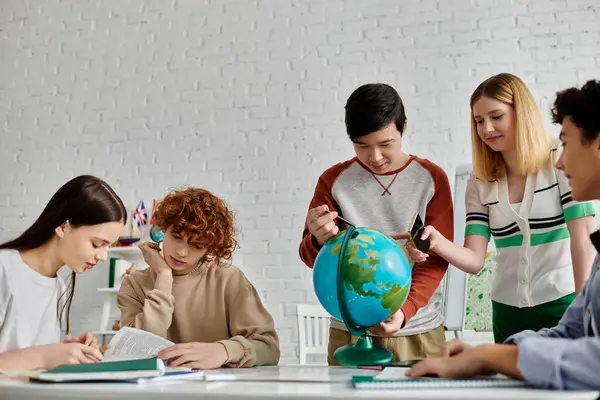 Teenagers participate in a UN Model simulation, studying a globe. — Stock Photo