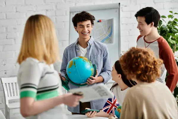 Teens use globe in animated UN Model talk. — Stock Photo