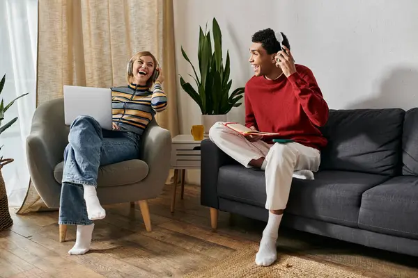 A happy multicultural couple spends a relaxing day in their modern apartment, enjoying each others company. — Stock Photo