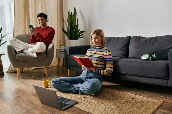 A multicultural couple enjoys a relaxed afternoon in their modern apartment. — Stock Photo