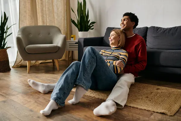 A happy multicultural couple spends quality time together, enjoying each others company in a modern apartment. — Stock Photo