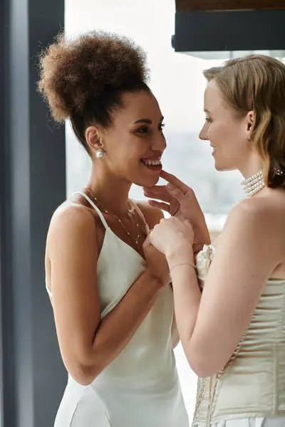 Two brides in love share a tender moment on their wedding day. — Stock Photo