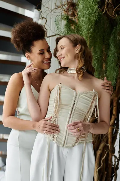 A lesbian couple on their wedding day, beaming with happiness as they share a tender moment. — Stock Photo