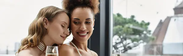 Two brides share a loving moment at their wedding reception. — Stock Photo