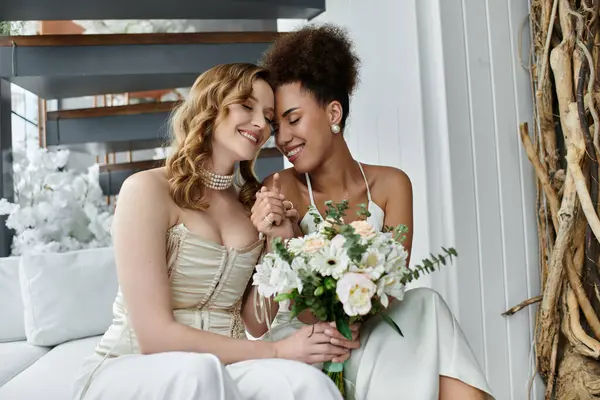 Two brides share a tender moment on their wedding day. — Stock Photo