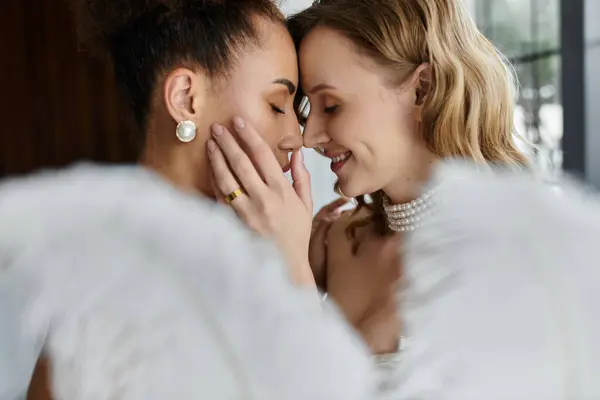 Two brides share a tender moment on their wedding day. — Stock Photo