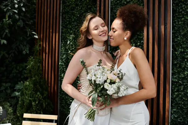 A lesbian couple share a tender kiss on their wedding day. — Stock Photo