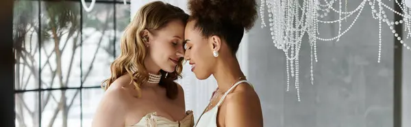 Two brides embrace on their wedding day, their foreheads touching in a tender moment of love. — Stock Photo