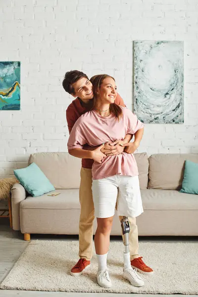 A couple shares a tender moment in their home, showcasing their love and support. — Stock Photo