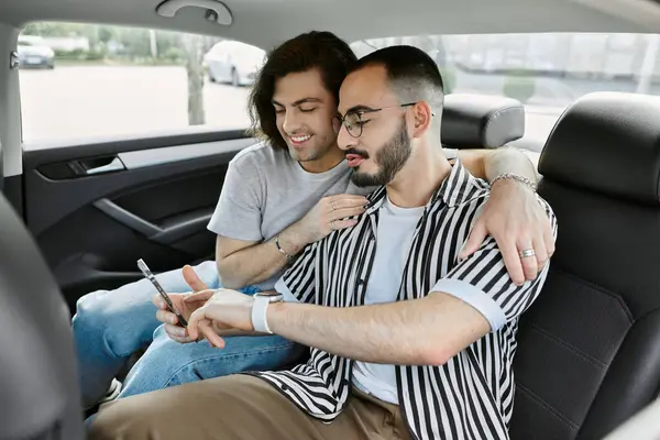 A gay couple enjoys a ride in a car together. — Stock Photo