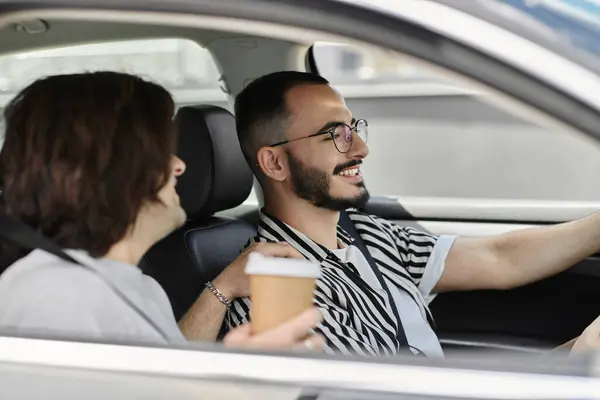 A gay couple enjoys a drive together. — Stock Photo